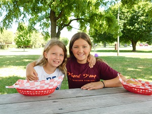 Two Girls at Picnic Smiling